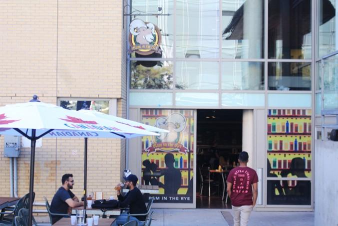 Students at the ram eating their meal on a paper doilie. PHOTO: SARAH KRICHEL
