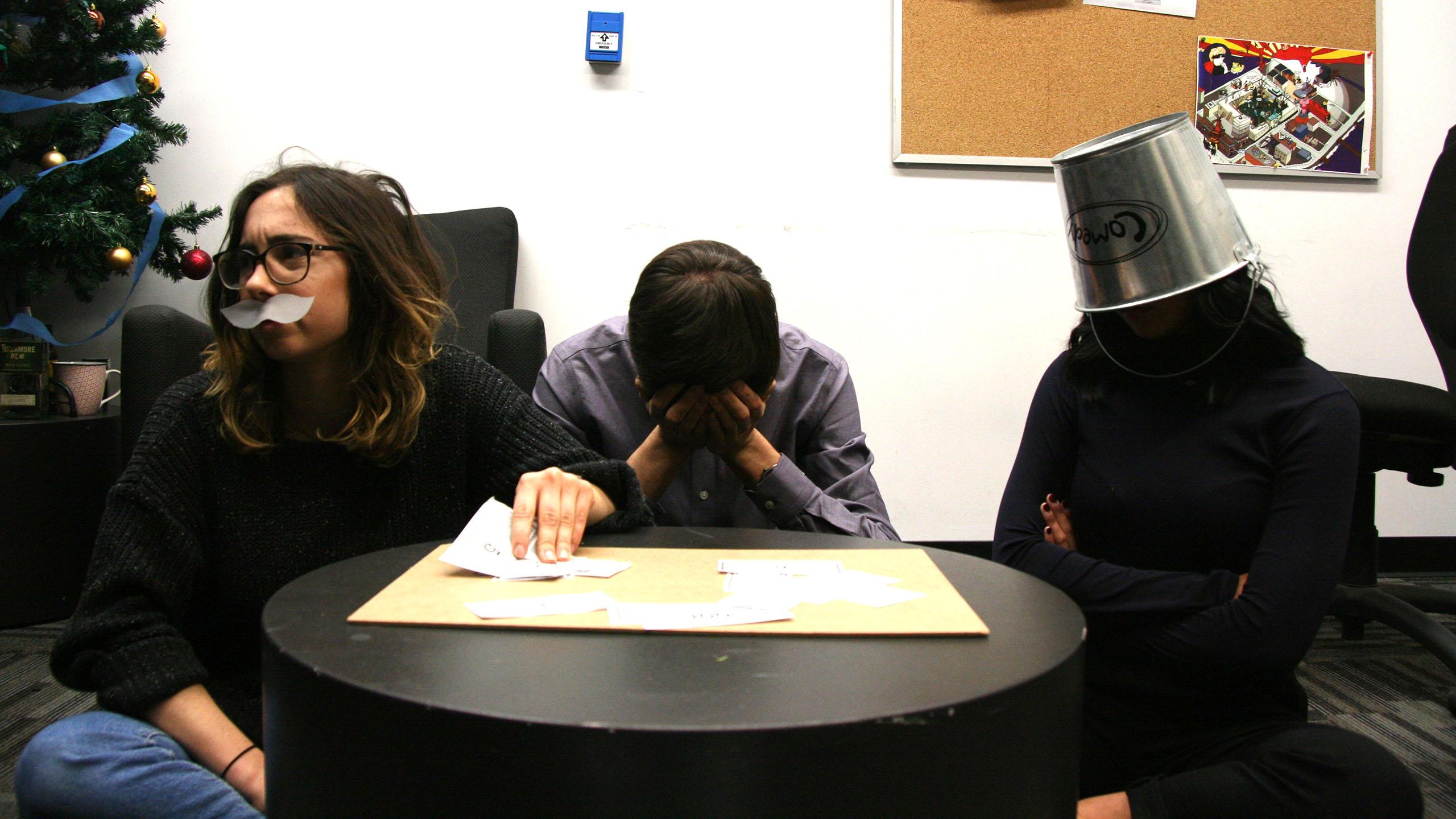 A man grips his head in agony while losing his best friends over a game of monopoly.