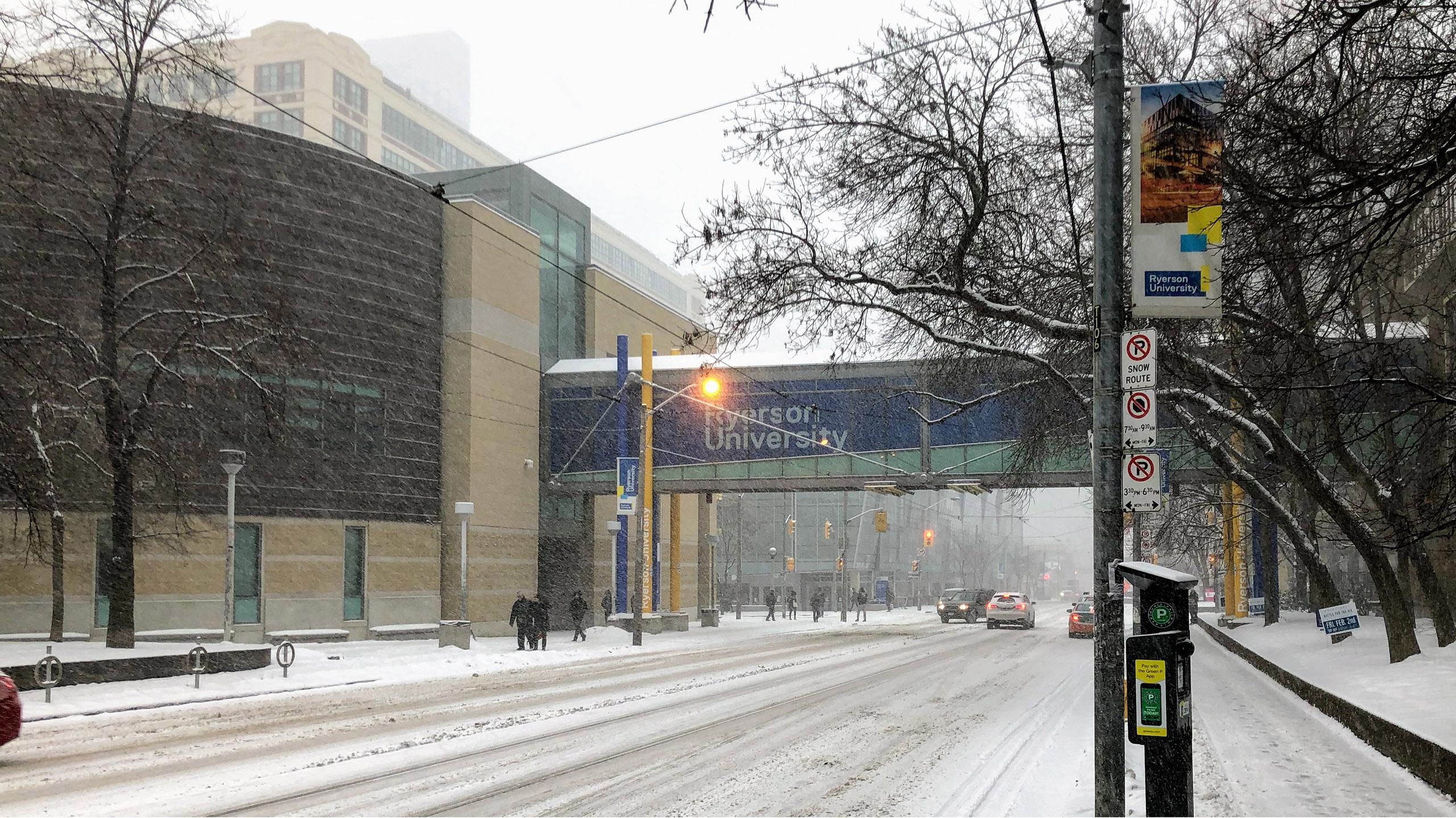 A shot of the bridge that connects the RCC to Kerr Hall. It's winter and snowing.