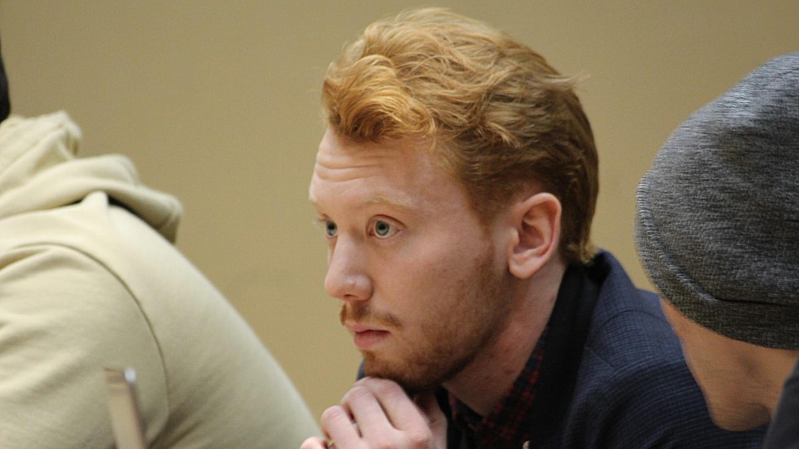 Maklane deWever sits with his hands on his chin