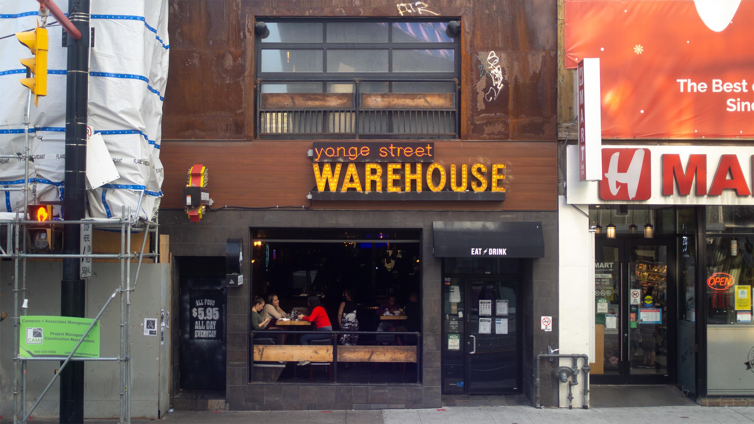 Photo of Warehouse, a busy bar on Yonge Street.