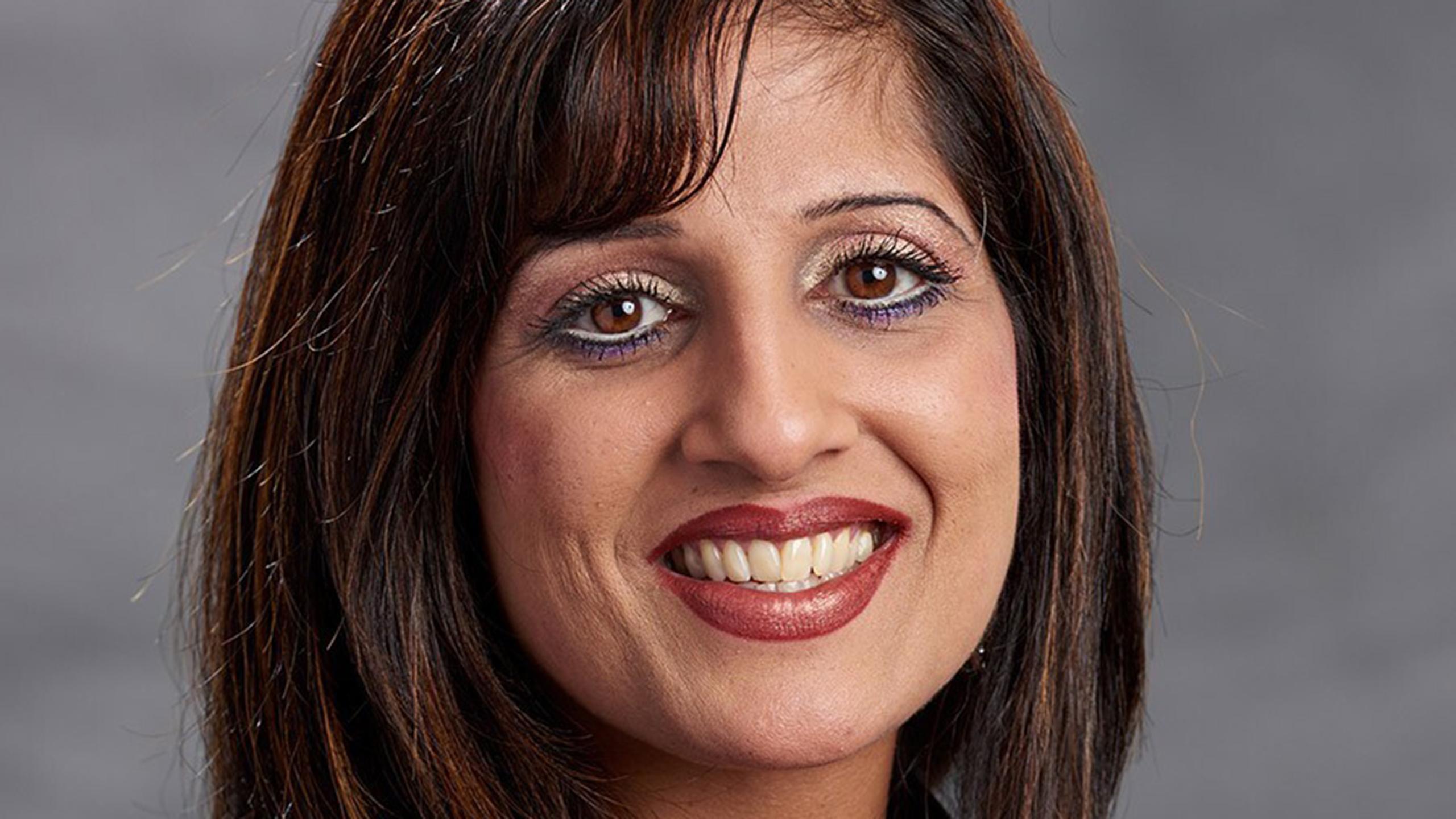 Photo of Pria Nippak smiling.