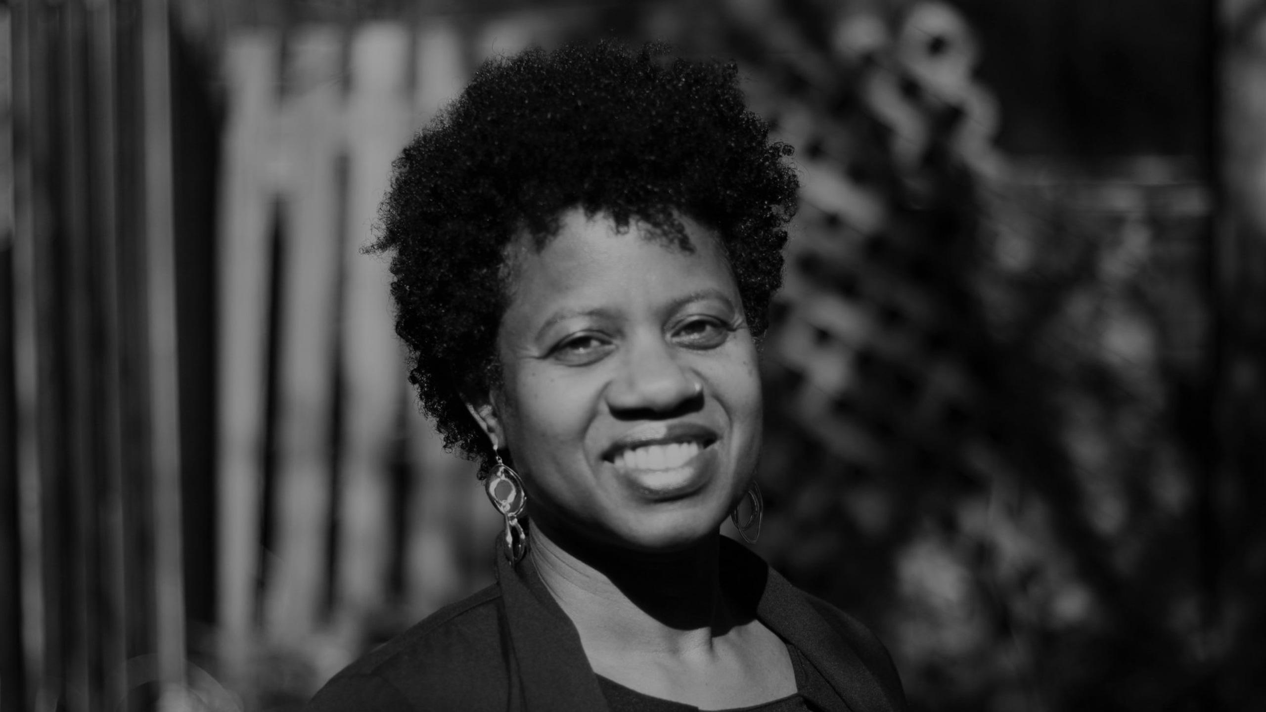 A photo of Christene Johnson smiling.