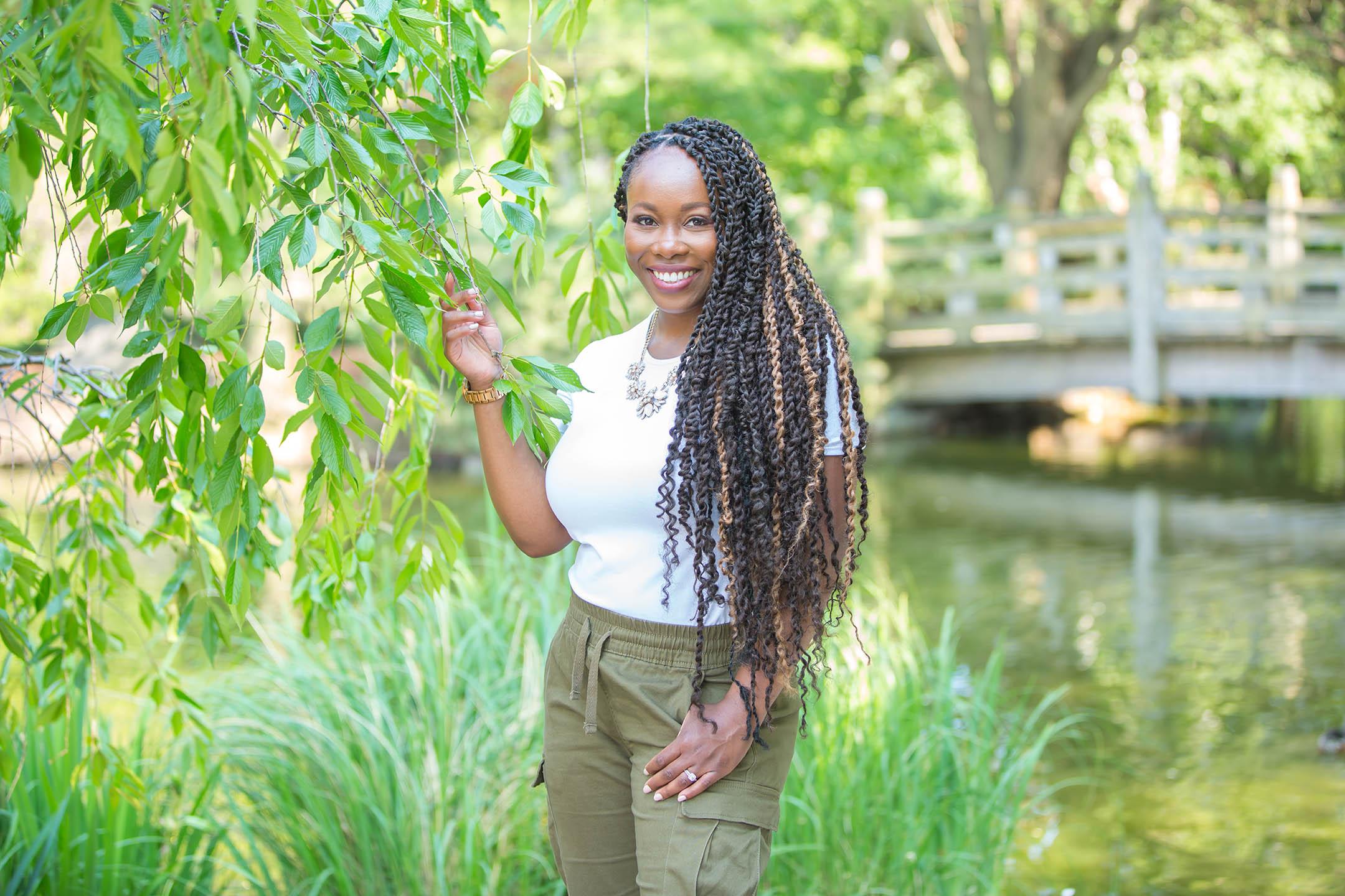 A photo of Alison Smith standing in a garden.