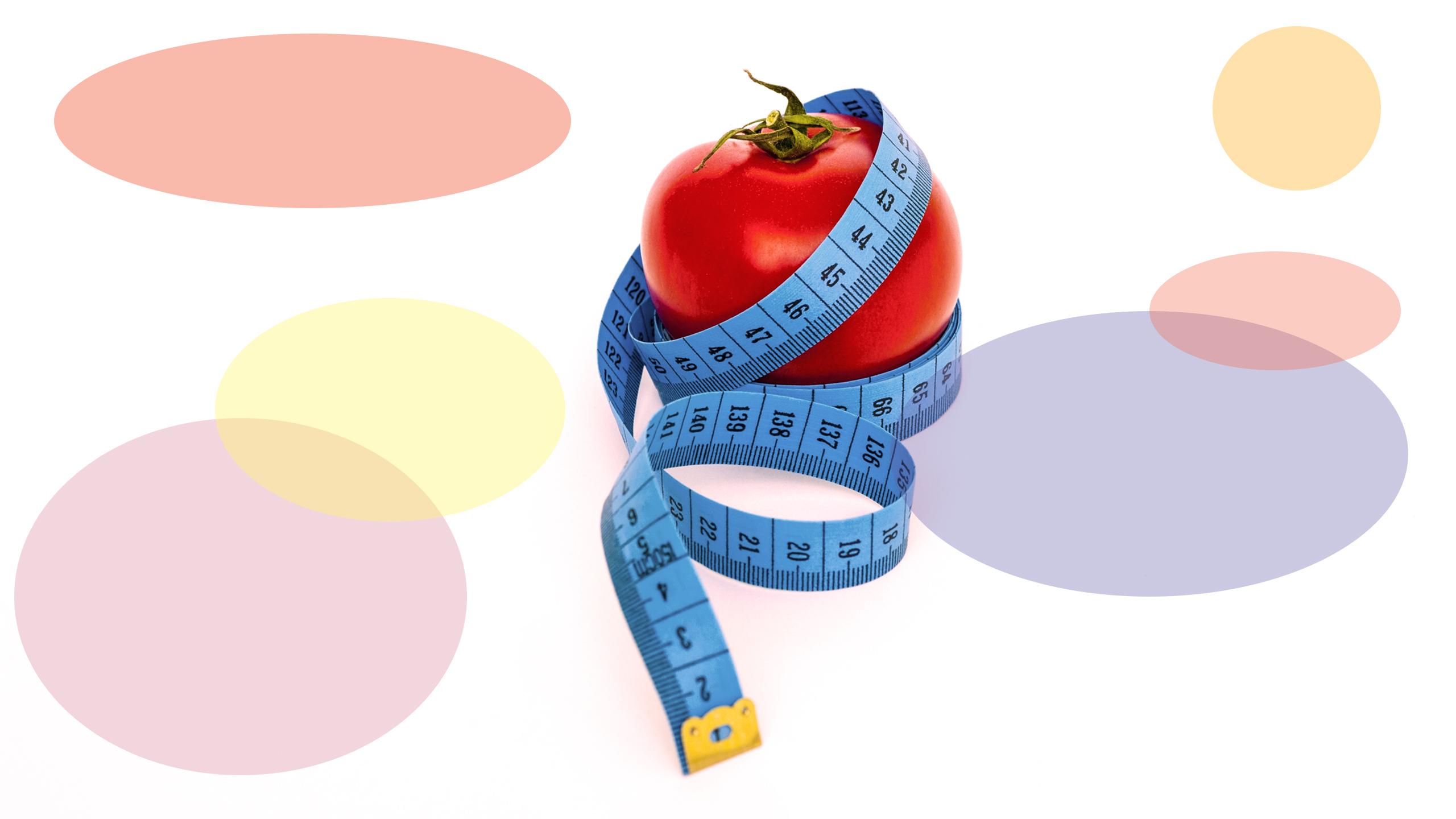 Apple with measuring tape wrapped around it