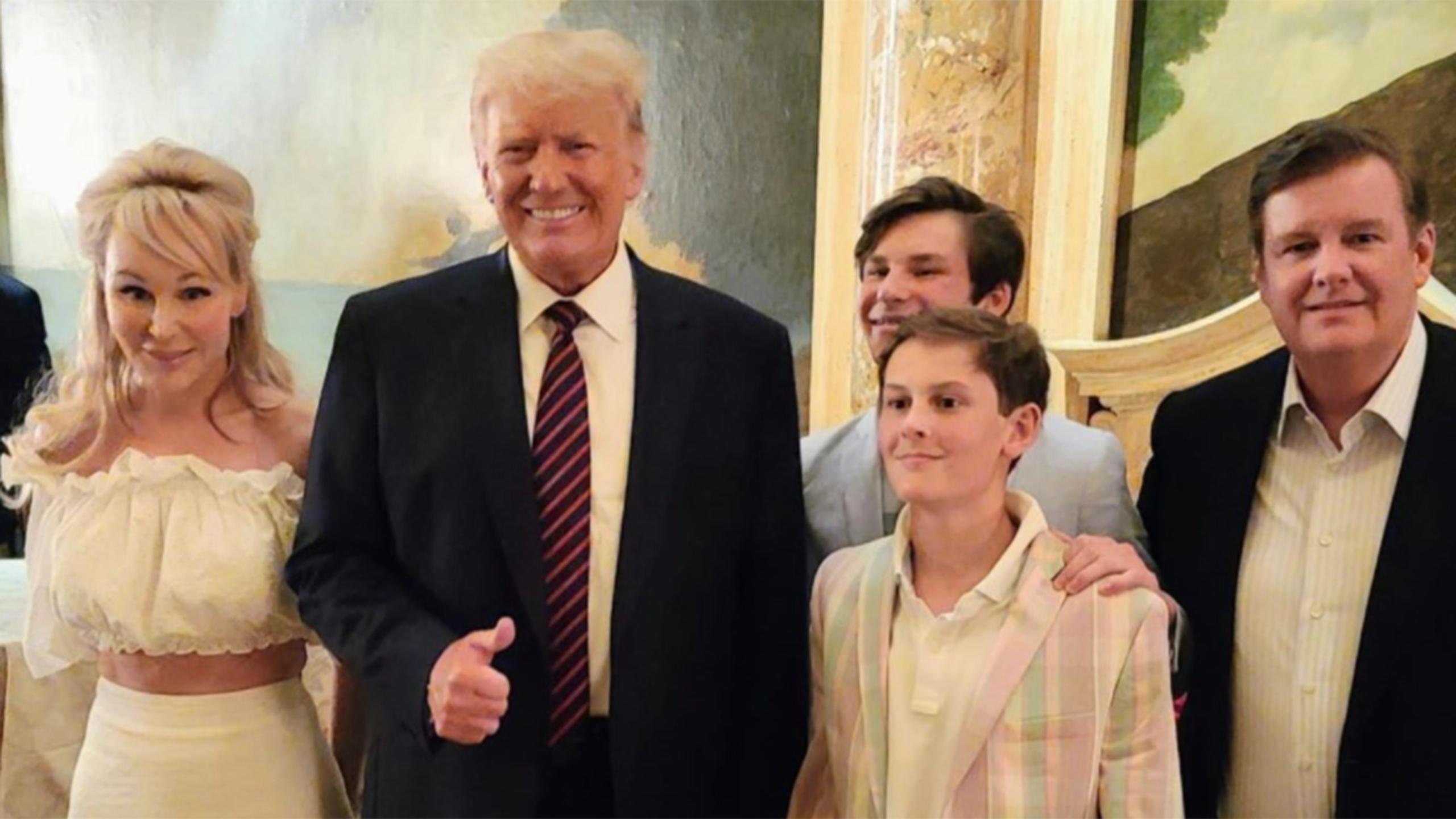 Suzanne Rogers, left, and her family posing with Donald Trump in a photo posted to Instagram.