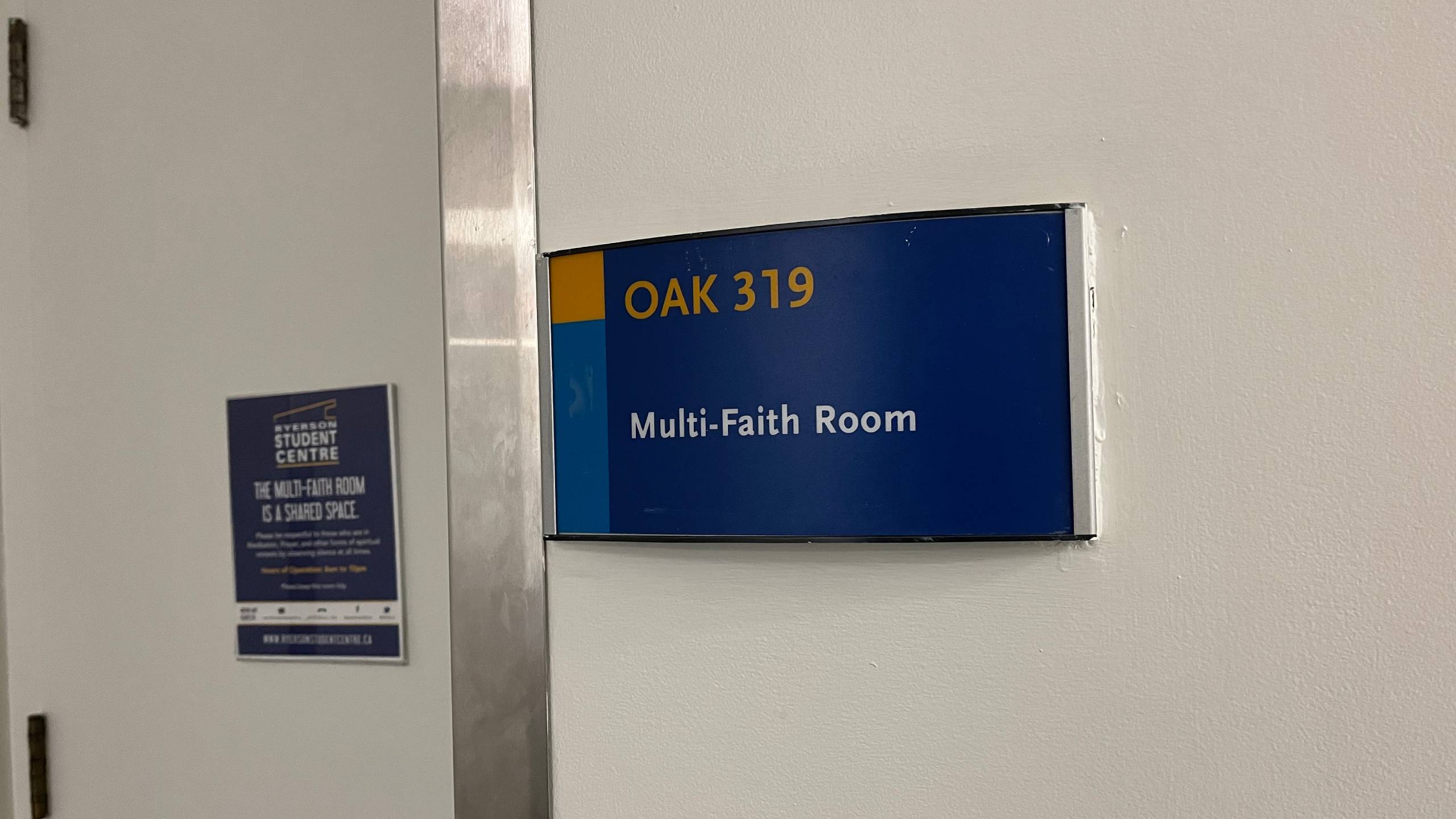 an image of the name plaque outside the multi-faith room that reads "OAK 319 multi-faith room"