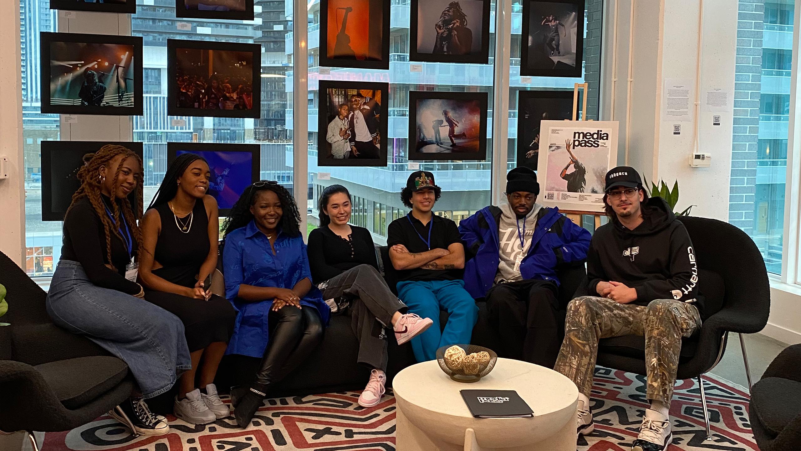 an image of the 6 members sitting on a couch