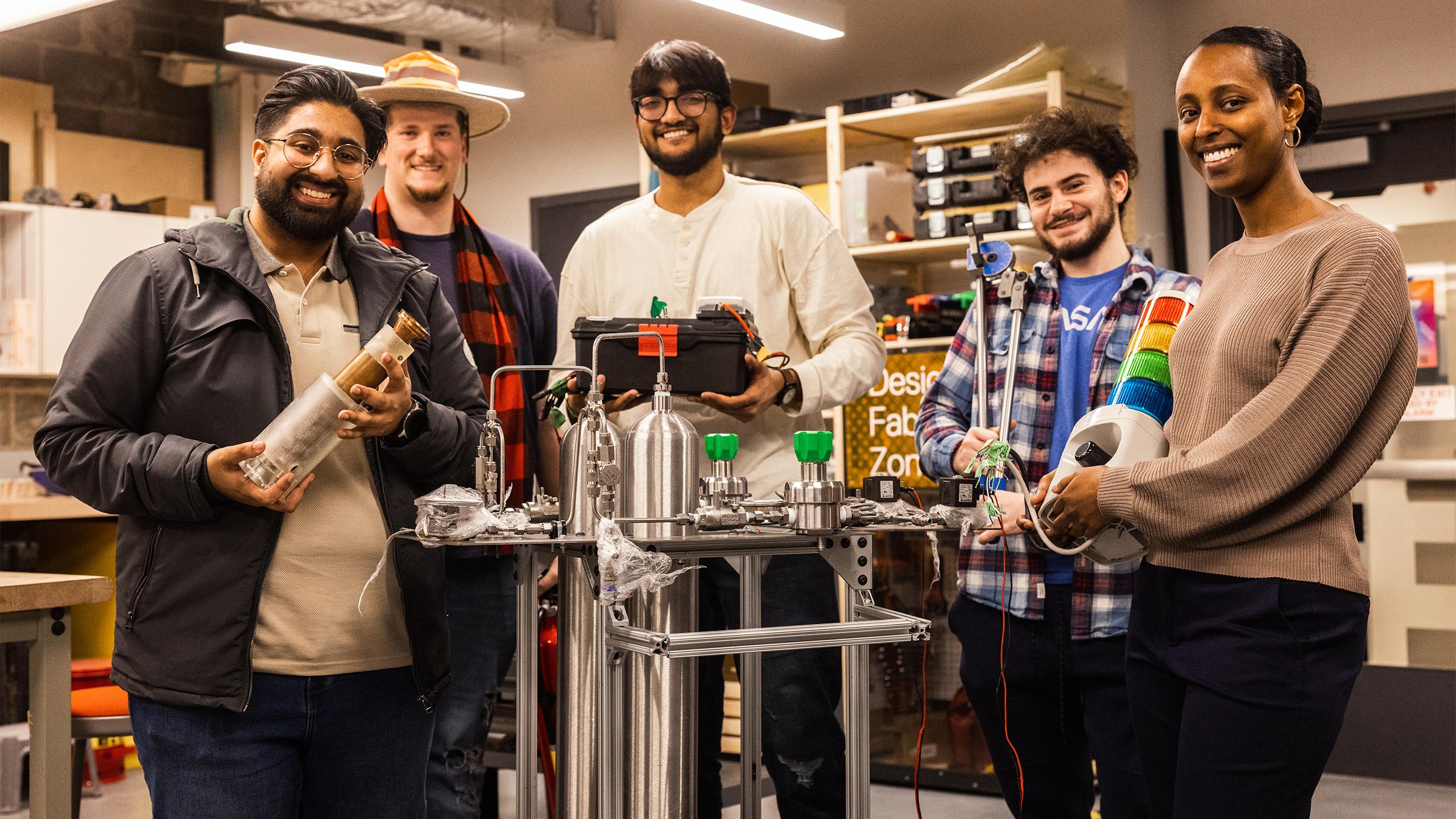 Group of students around propellant stand