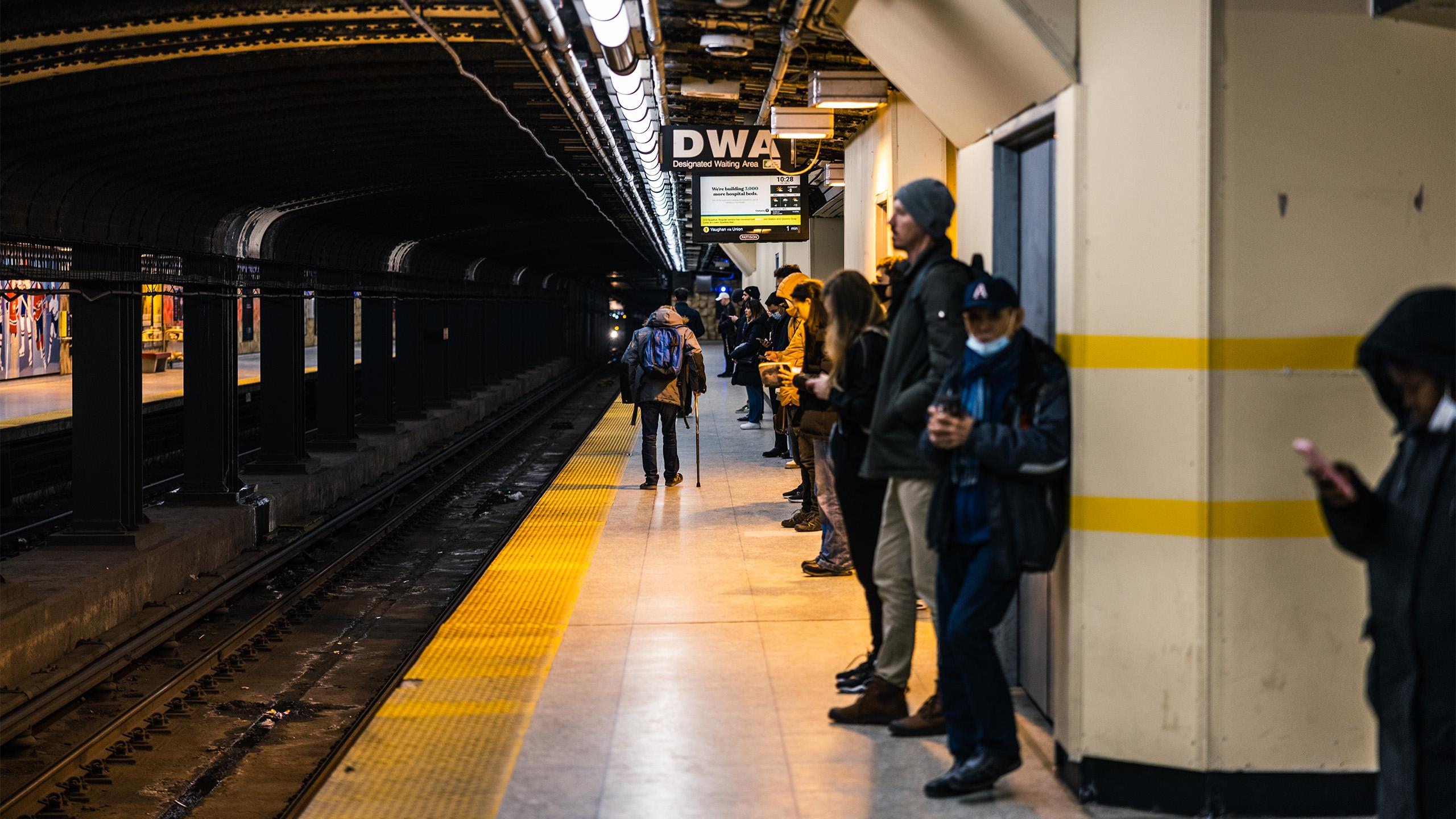 People waiting on a subway platform