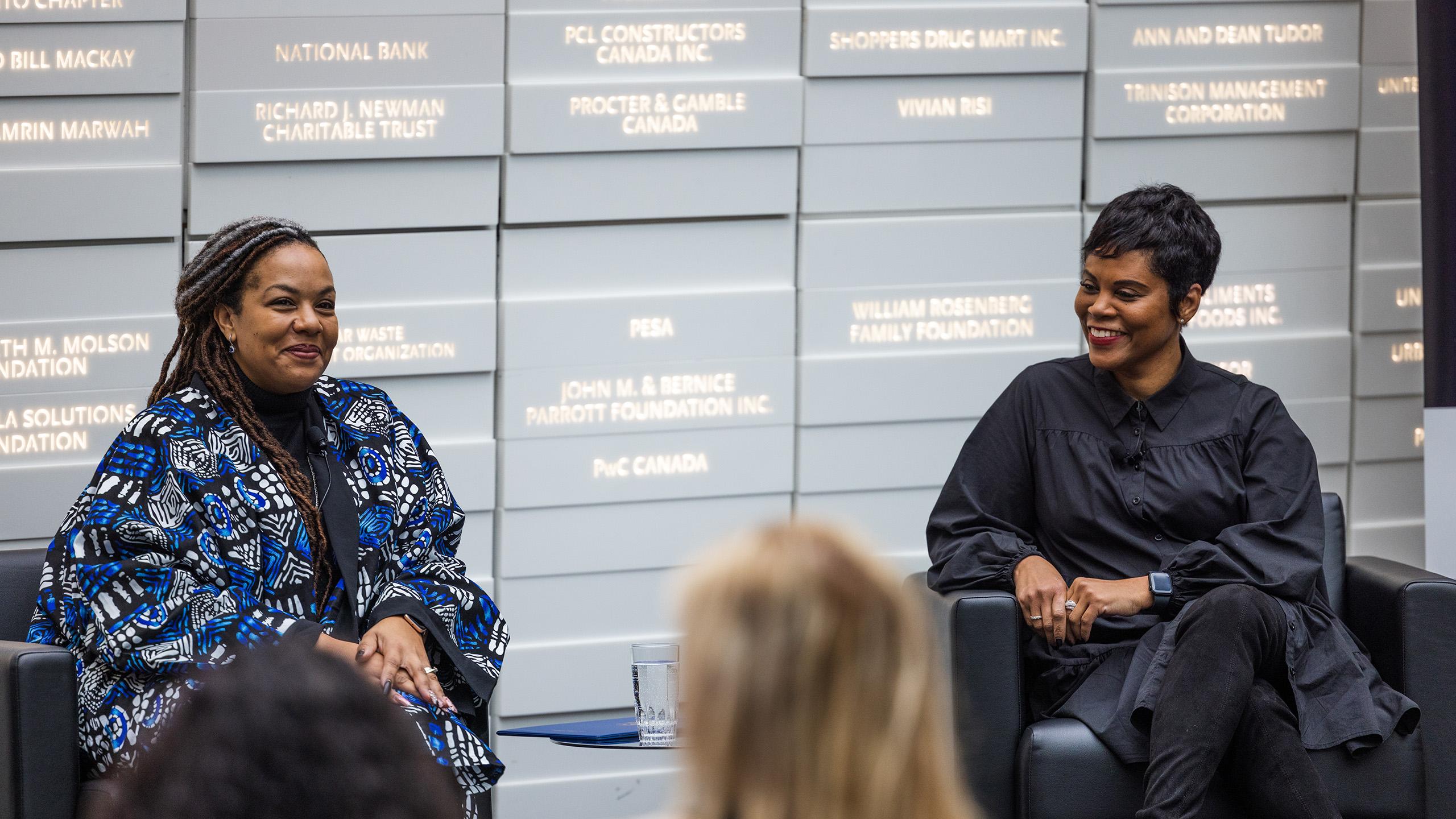 Charmaine Williams (Left) and Marci Ien (Right) sit next to each other