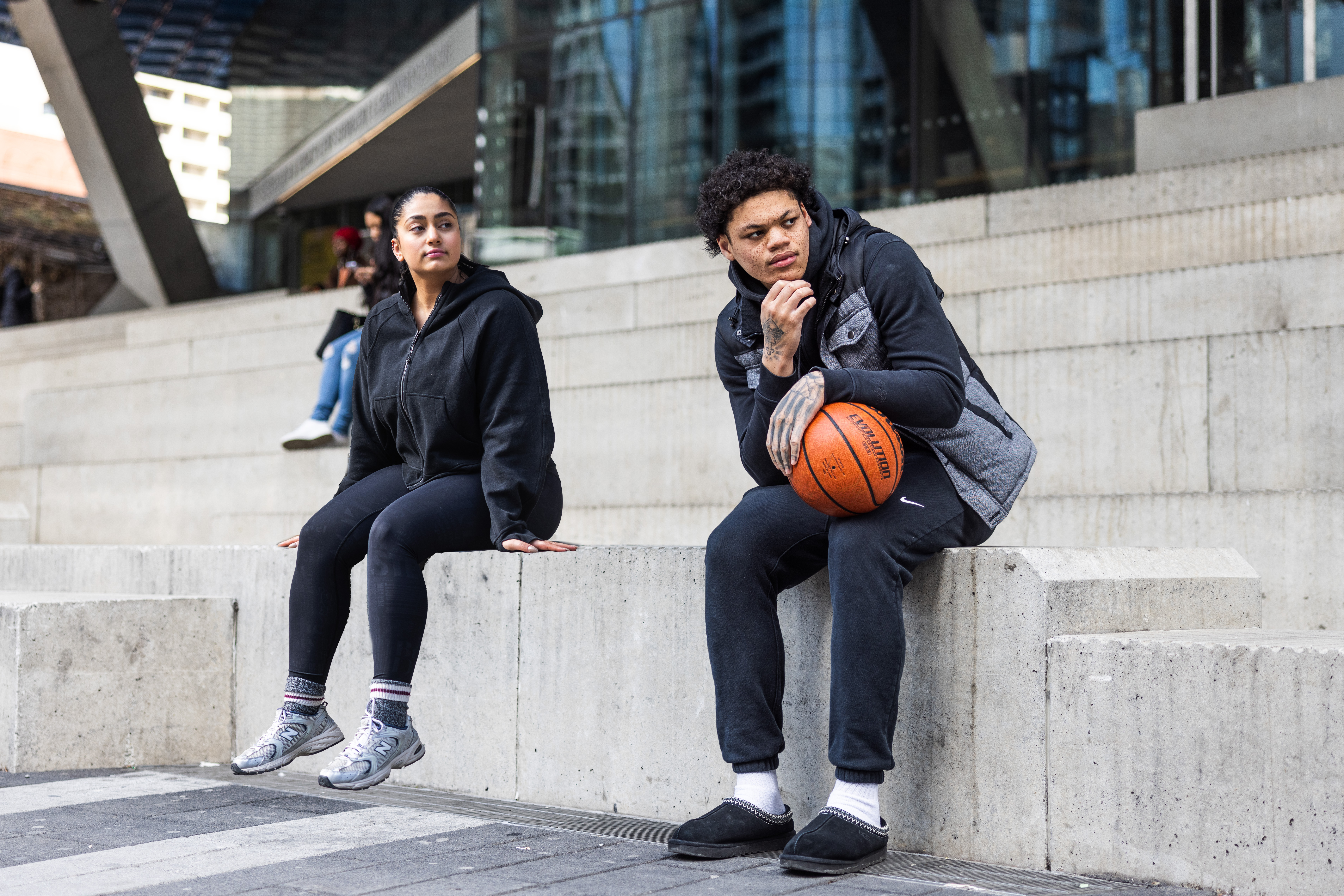 image of the two sources sitting on the steps infront of the SLC