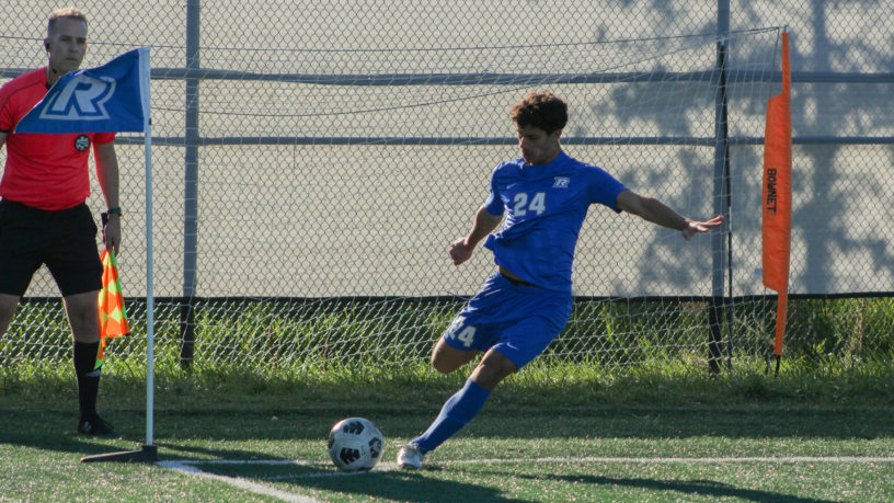 Bold men's soccer player Bilal Reslan prepares to take a corner kick