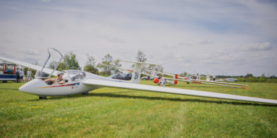 Row of gliders on field