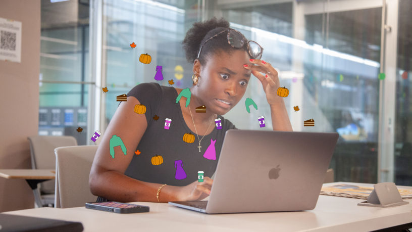 Woman surprised looking at laptop screen with illustrations