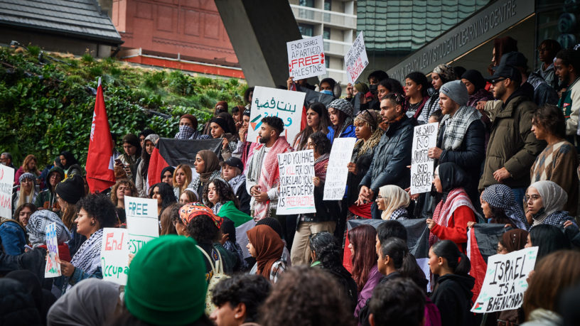 TMU Students hold signs at a rally outside Toronto Metropolitan University