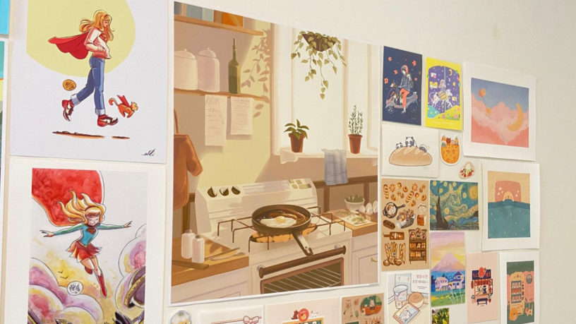 Various posters on a white wall