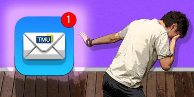 Person scared of email looks away from glowing TMU email app icon