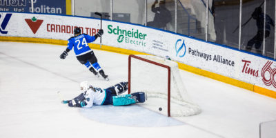 PWHL Toronto player Natalie Spooner raises her stick in the air after scoring a shootout goal