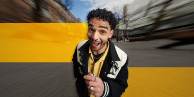 Moose bendago holding mic