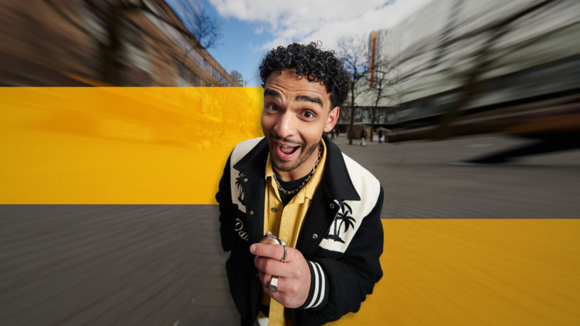 Moose bendago holding mic