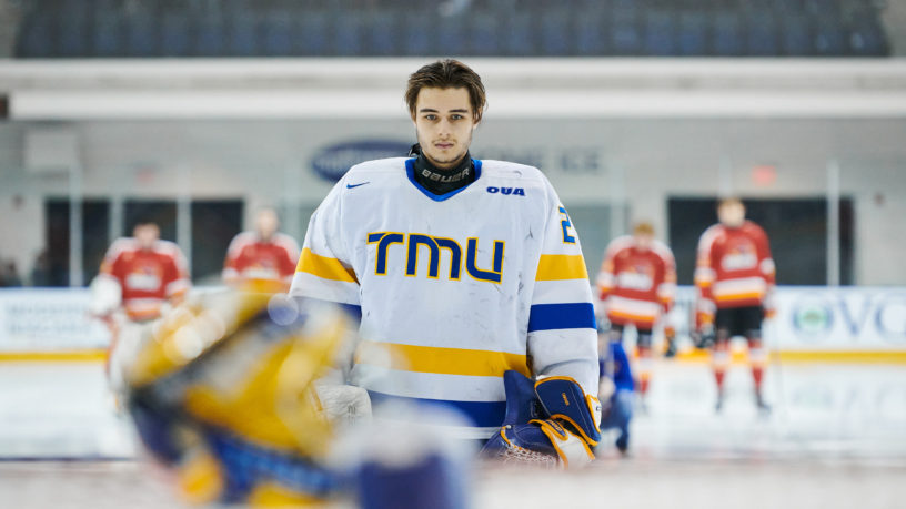 TMU goalie Kai Edmonds stands in front of his post during the national anthem