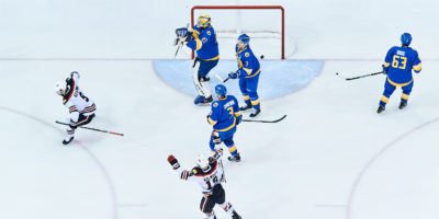 UNB players celebrate after scoring on the TMU net