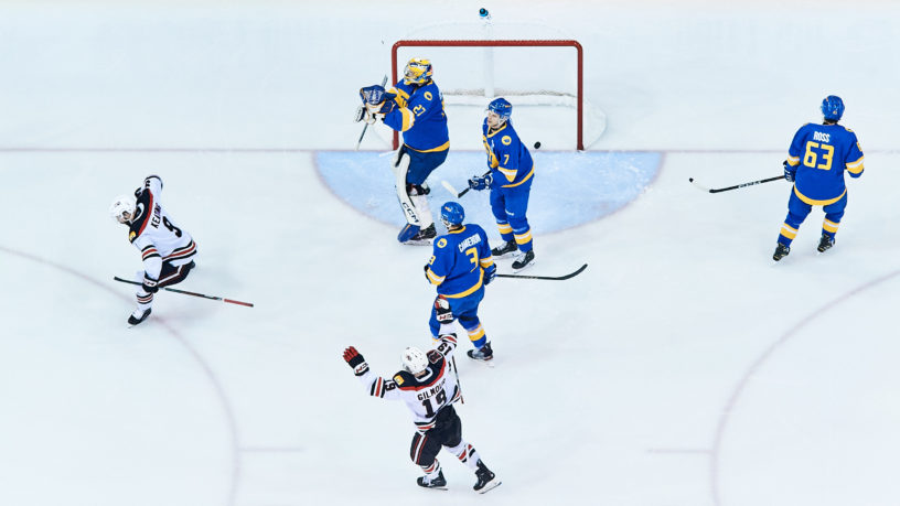 UNB players celebrate after scoring on the TMU net