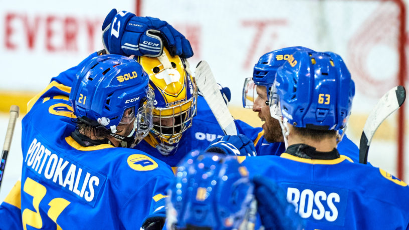 Members of the Bold men's hockey team celebrates