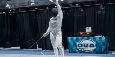 TMU Fencer Erika Dominguez holds fist in the air