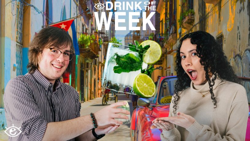 a man and women with stocked faces, in the middle a minty green drink with a lime on the side of class. background of a street in Cuba