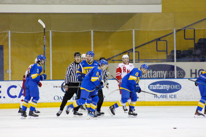TMU Bold skate past the RMC net after a goal