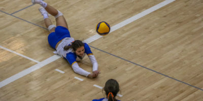 Scarlett Gingera dives for a volleyball