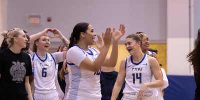 The TMU Bold women's team celebrating the win over the Badgers