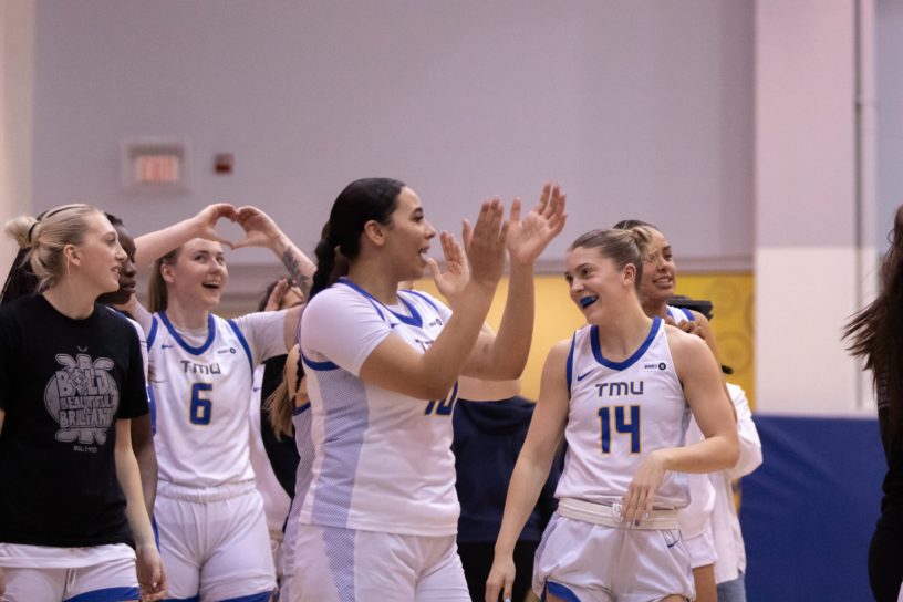 The TMU Bold women's team celebrating the win over the Badgers