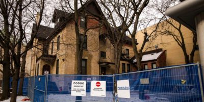 A photo on former residence house O'Keefe House fenced off with construction signs