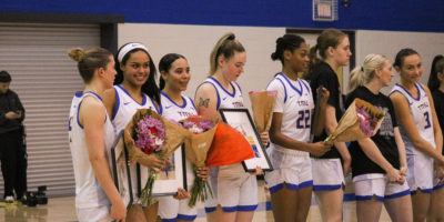 The TMU Bold players celebrating their career as a bold player in senior night