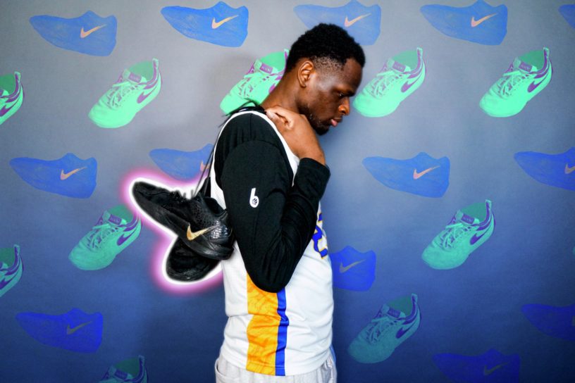 Photo of an athlete with shoes slung over his back over a decorated background with assets