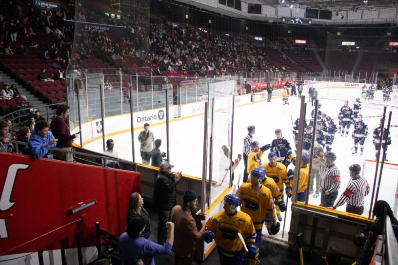 Bold players leaving the rink