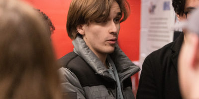 Mitchell Fox asking a question in a scrum interview