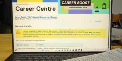 A laptop is open to a website titled "Career Centre," a student job application portal.