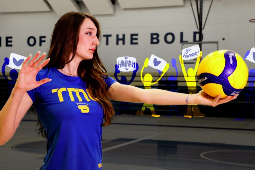 A volleyball athlete stands ready to serve, with illustrated people standing in the back