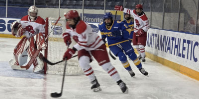 A York player keeps the puck away from the net