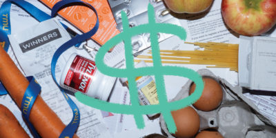 Photo of eggs, carrots, apples, spaghetti and various medications on top of receipts and bills. Illustration of a green dollar sign on top.