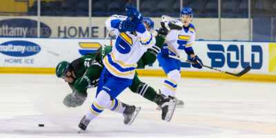 A TMU and UPEI player clash into each other