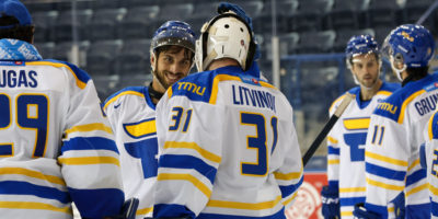 TMU celebrates their win against Ontario Tech