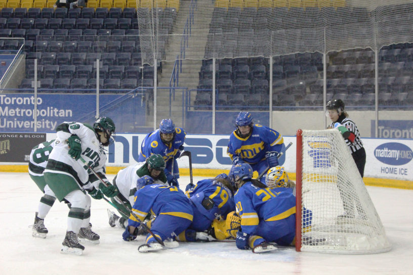 TMU scrambles to prevent UPEI from scoring a goal