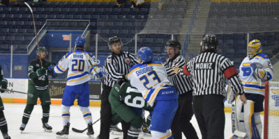 Players from TMU and UPEI get into a scrum