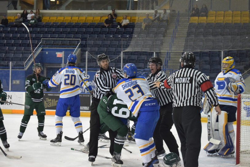 Players from TMU and UPEI get into a scrum