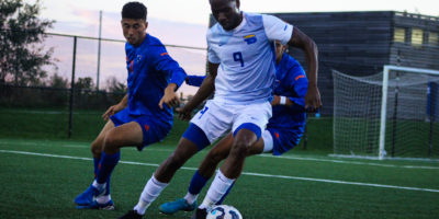 A TMU player maintains possession of the ball